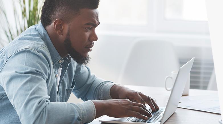 Man using a laptop.